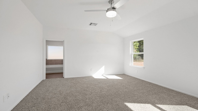 unfurnished bedroom with carpet flooring, ceiling fan, and vaulted ceiling