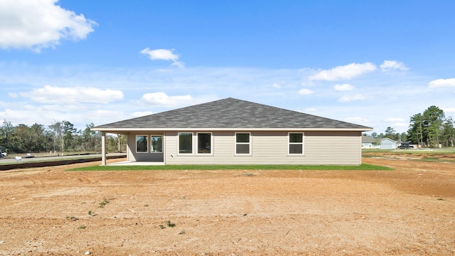 rear view of property featuring a patio