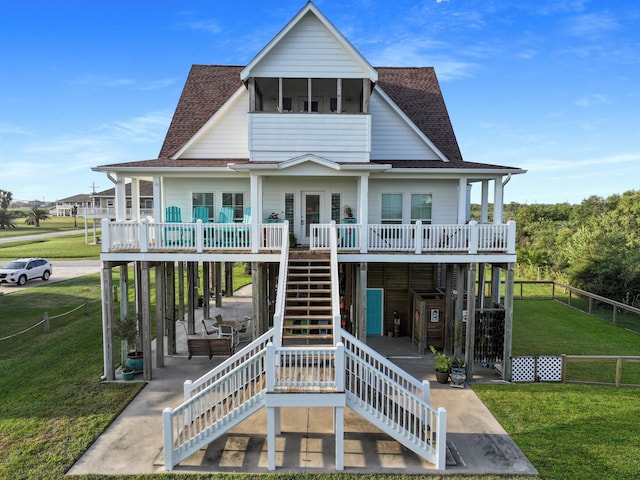 rear view of house with a yard and a patio area