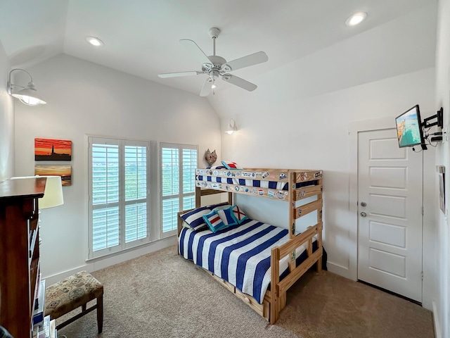 bedroom with carpet, ceiling fan, and vaulted ceiling