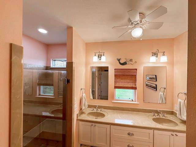 214 Biloxi, Crystal Beach, TX 77650 - full bathroom with healthy amount of natural light, a ceiling fan, and double vanity