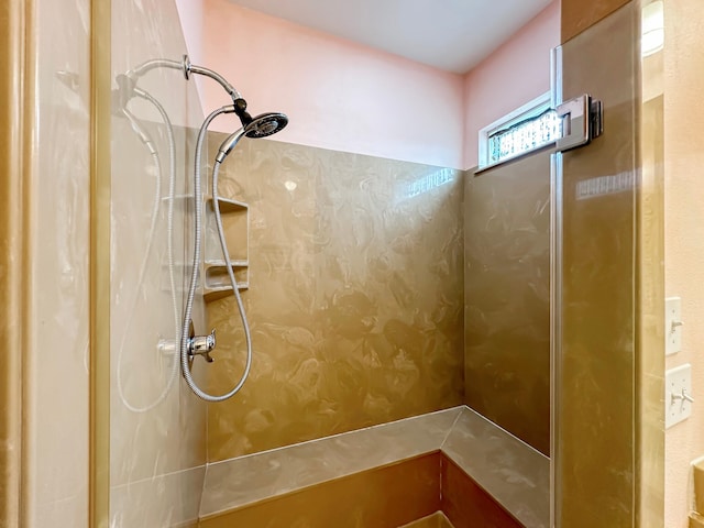 bathroom featuring a tile shower