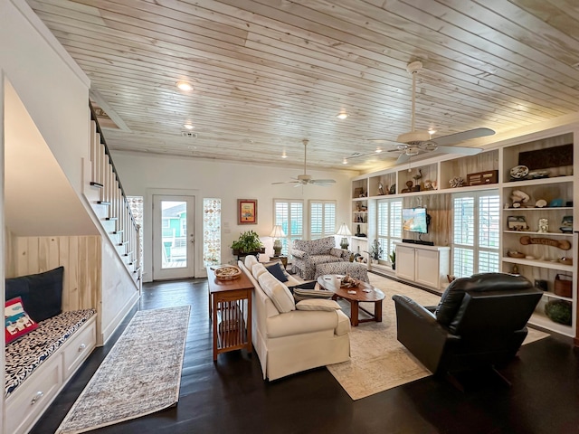 living room featuring hardwood / wood-style floors, a wealth of natural light, ceiling fan, and wooden ceiling