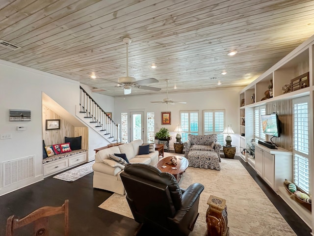 living room with hardwood / wood-style floors, built in features, ceiling fan, and wood ceiling