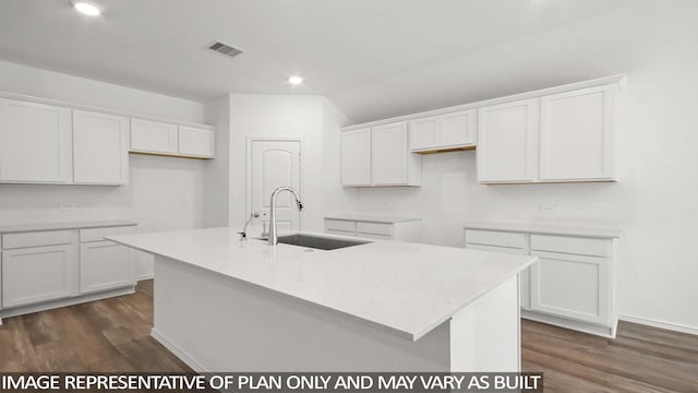 kitchen featuring white cabinetry, dark hardwood / wood-style floors, a kitchen island with sink, and sink