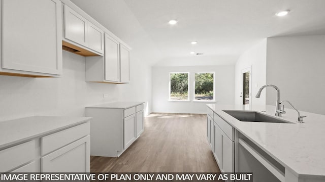 kitchen featuring white cabinetry, sink, and dishwasher