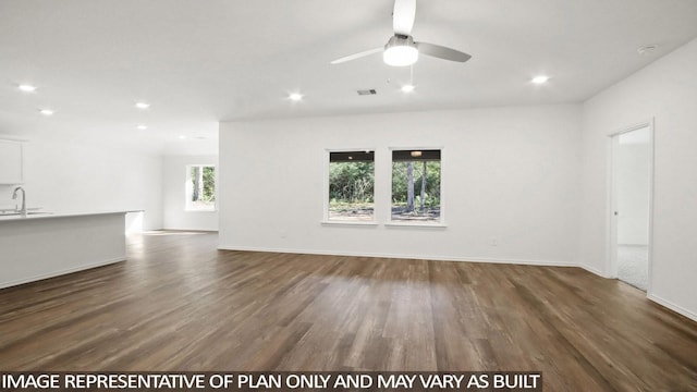 spare room with sink, dark hardwood / wood-style floors, and ceiling fan