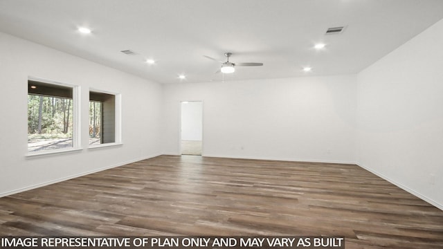 empty room with dark hardwood / wood-style flooring and ceiling fan