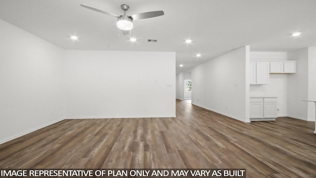 interior space featuring dark wood-type flooring and ceiling fan