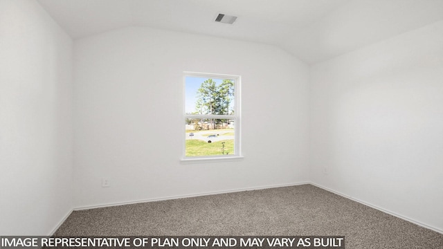 unfurnished room featuring vaulted ceiling and carpet floors