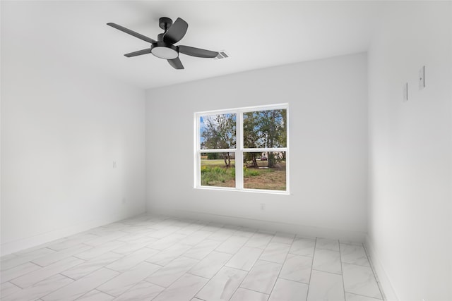 unfurnished room featuring ceiling fan