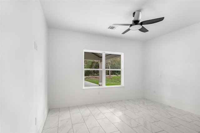 spare room with ceiling fan