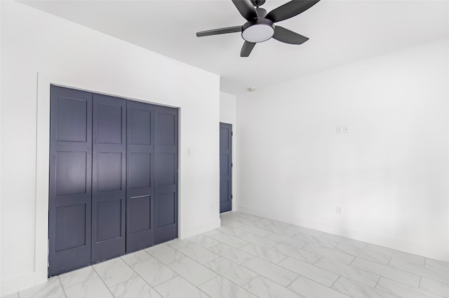 unfurnished bedroom with ceiling fan and a closet