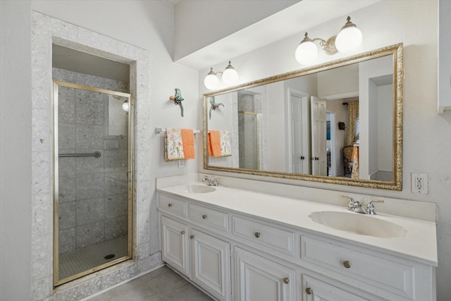 bathroom featuring tile patterned floors, vanity, and an enclosed shower