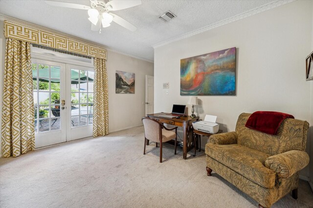 carpeted home office with ceiling fan, ornamental molding, a textured ceiling, and french doors