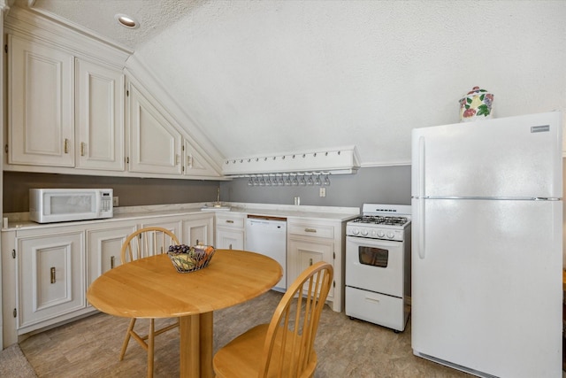 kitchen with white cabinetry, white appliances, a textured ceiling, and light hardwood / wood-style flooring