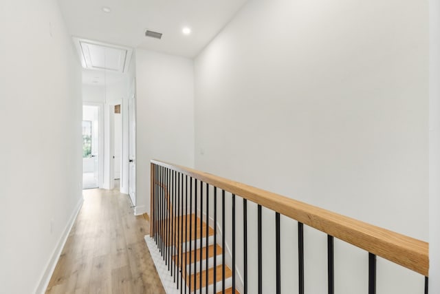 hall with light hardwood / wood-style flooring