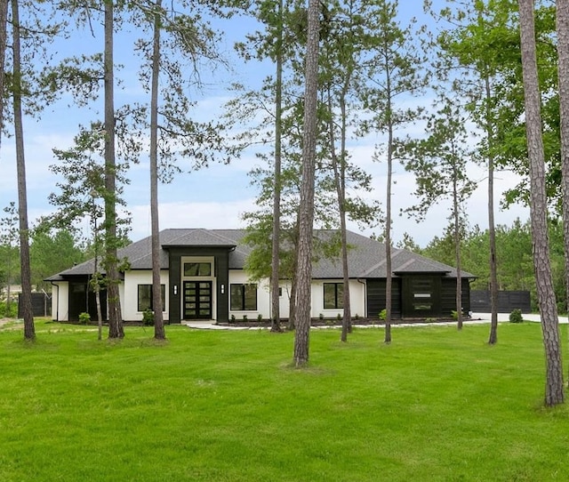 back of house featuring a yard