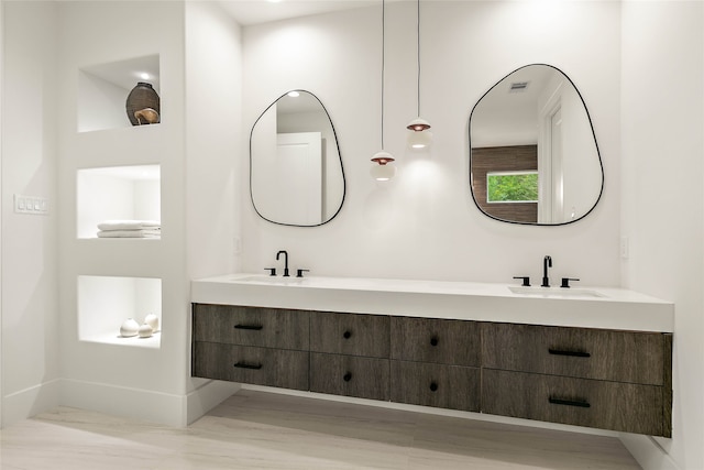 bathroom with vanity and wood-type flooring