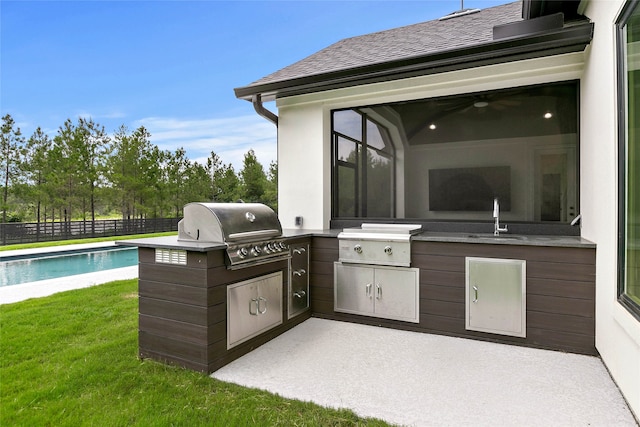 view of patio / terrace featuring area for grilling, grilling area, and sink