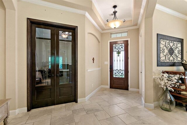 entrance foyer featuring crown molding