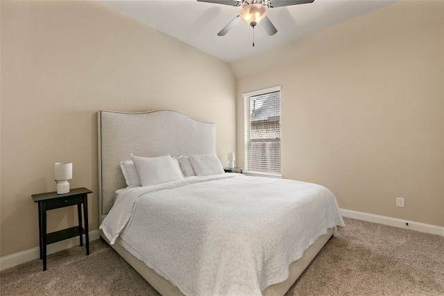 carpeted bedroom with vaulted ceiling and ceiling fan