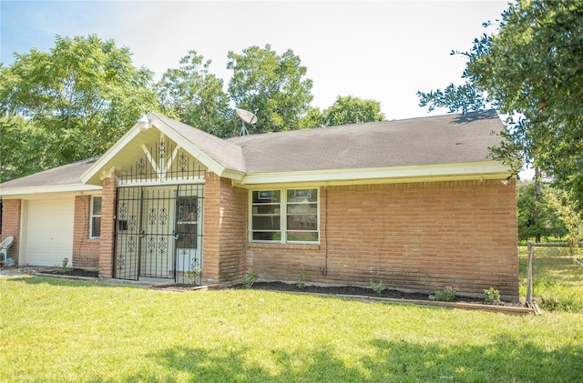 rear view of house featuring a yard