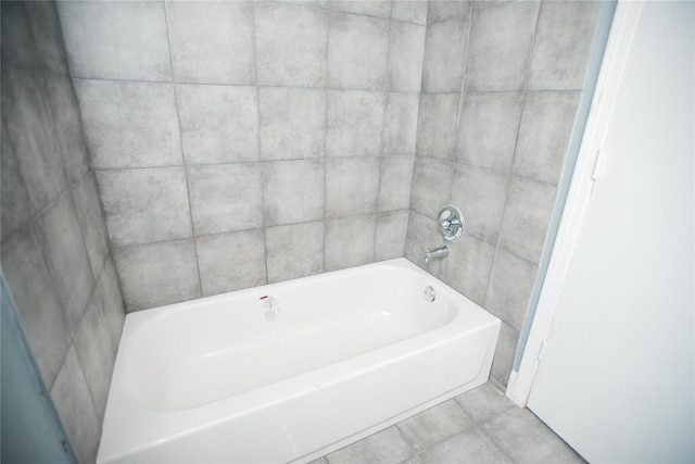 bathroom featuring a washtub and tile patterned floors