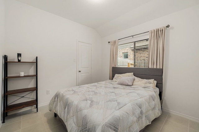 tiled bedroom with vaulted ceiling