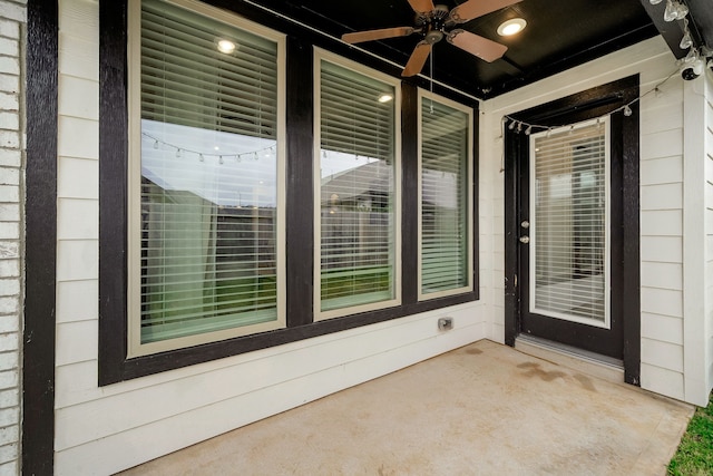 exterior space featuring ceiling fan