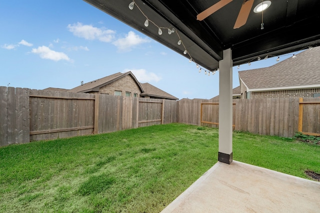 view of yard with ceiling fan