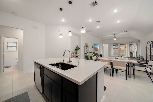 kitchen with pendant lighting, dishwasher, sink, ceiling fan, and an island with sink