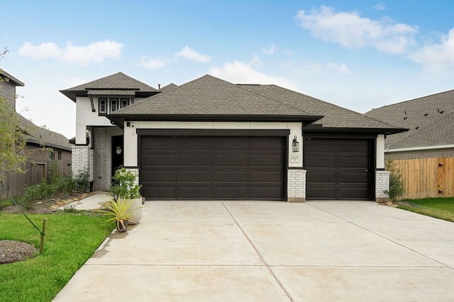 prairie-style house featuring a garage