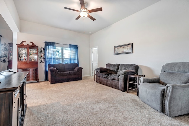 living room with ceiling fan and light colored carpet