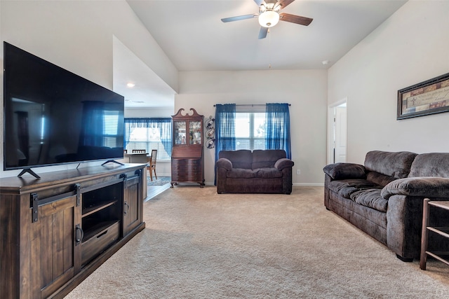 living room with ceiling fan and light carpet