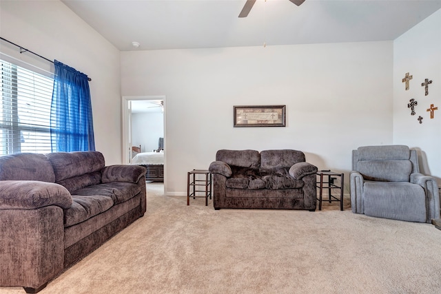 living room with ceiling fan and carpet flooring