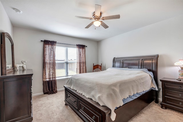 bedroom with light colored carpet and ceiling fan