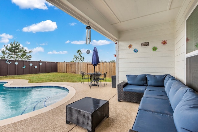 view of swimming pool with a patio, outdoor lounge area, and a yard