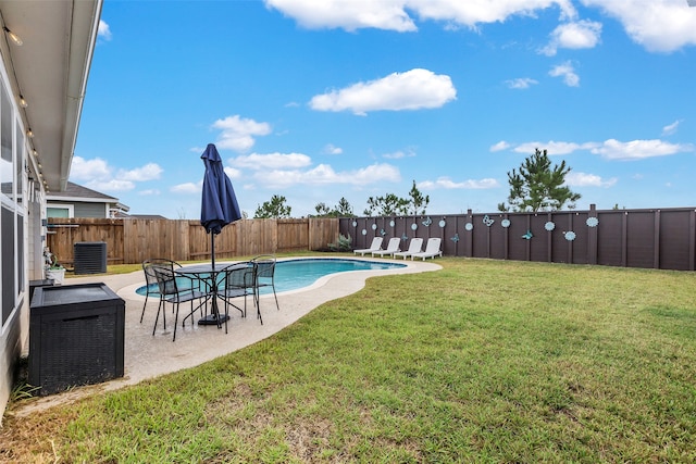 view of yard with a patio and a fenced in pool