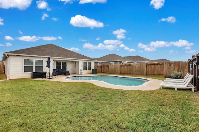 view of swimming pool featuring a lawn and a patio area