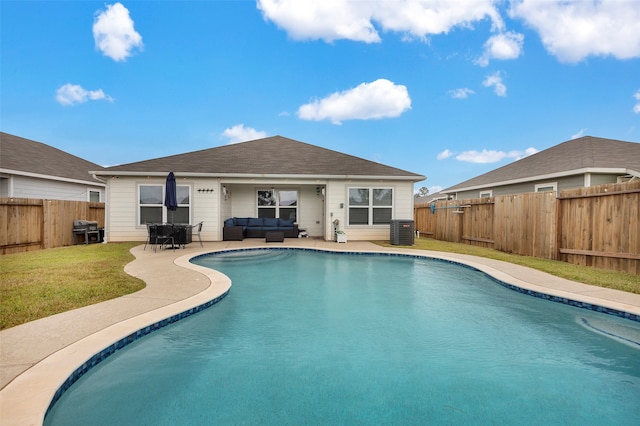 view of pool featuring a patio area, central AC, and grilling area