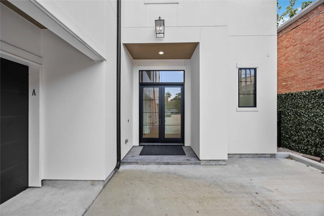 property entrance with french doors and a patio