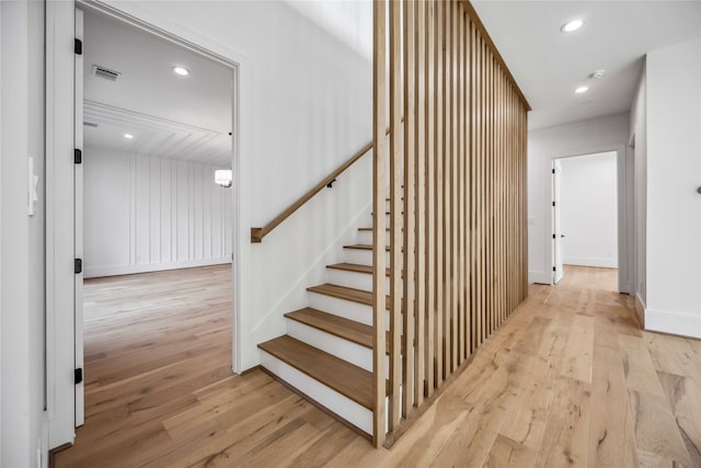 staircase featuring wood-type flooring