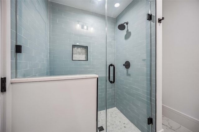 bathroom featuring an enclosed shower