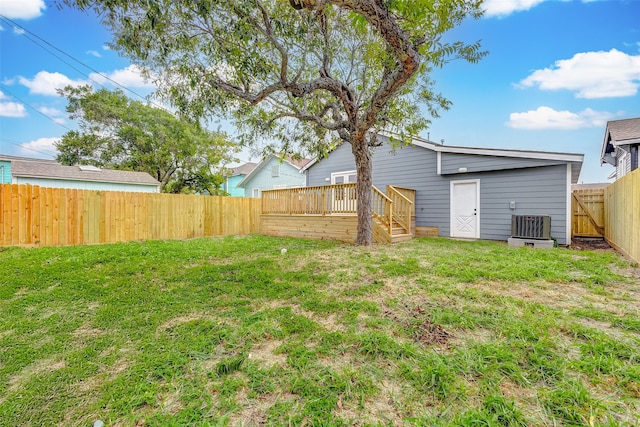 view of yard with cooling unit and a wooden deck