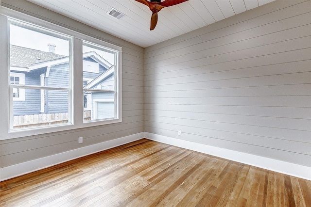 1324 Ursuline St, Galveston, TX 77550 - empty room featuring baseboards, a ceiling fan, and light wood-style flooring