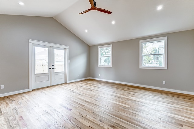 unfurnished room with ceiling fan, vaulted ceiling, french doors, and light hardwood / wood-style flooring