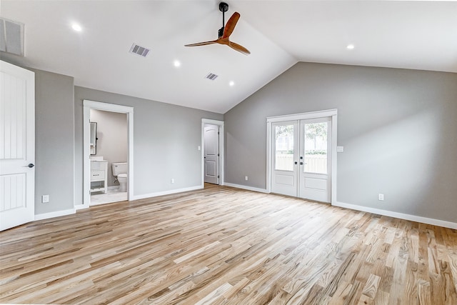 unfurnished living room featuring ceiling fan, light hardwood / wood-style floors, french doors, and vaulted ceiling