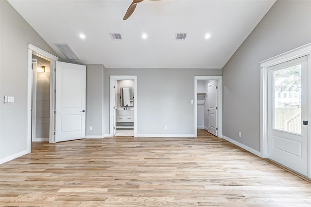 1324 Ursuline St, Galveston, TX 77550 - unfurnished bedroom featuring vaulted ceiling, connected bathroom, light wood-type flooring, baseboards, and ceiling fan