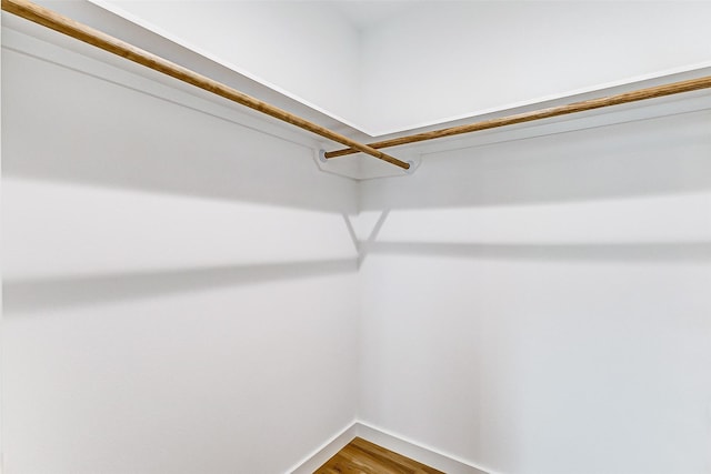 1324 Ursuline St, Galveston, TX 77550 - walk in closet featuring wood finished floors